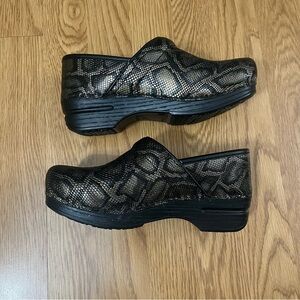 Dansko clogs with snake skin pattern